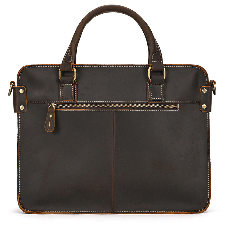 Back of the dark brown briefcase with a zip pocket across the top
